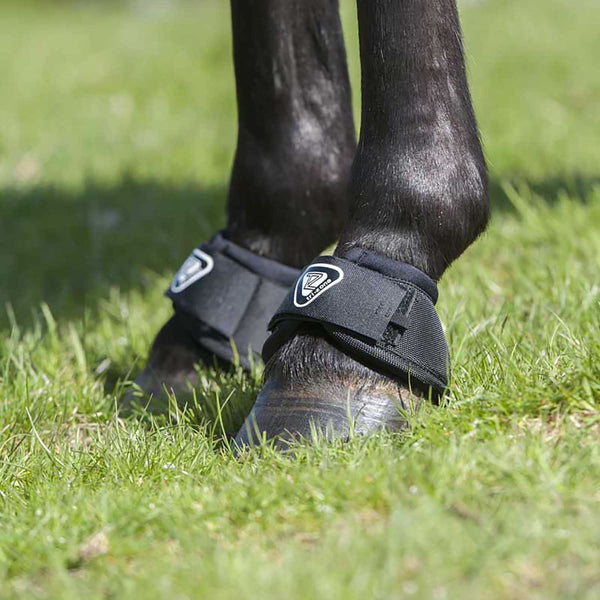 Horse wearing Equilibrium Tri-Zone Over Reach Boots