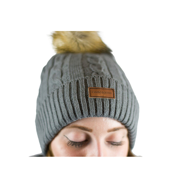 Close up of lady wearing Cameo Cable Knit Bobble Hat in grey