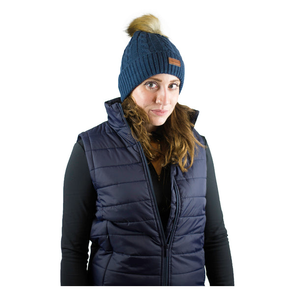 Lady wearing Cameo Cable Knit Bobble Hat in navy