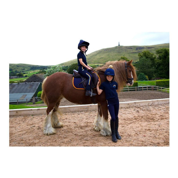 Two riders wearing Rainbow Riders Polo Shirt