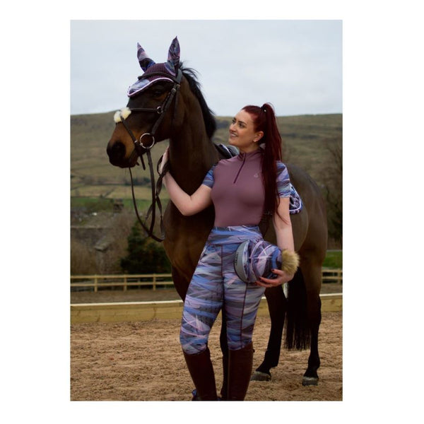 Rider wearing Cameo Zest Riding Tights in Splash