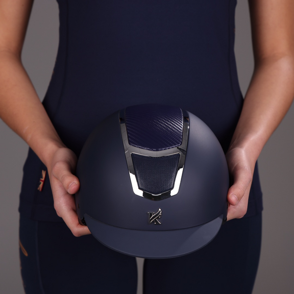 Rider holding Karben Sienna Riding Hat in Navy