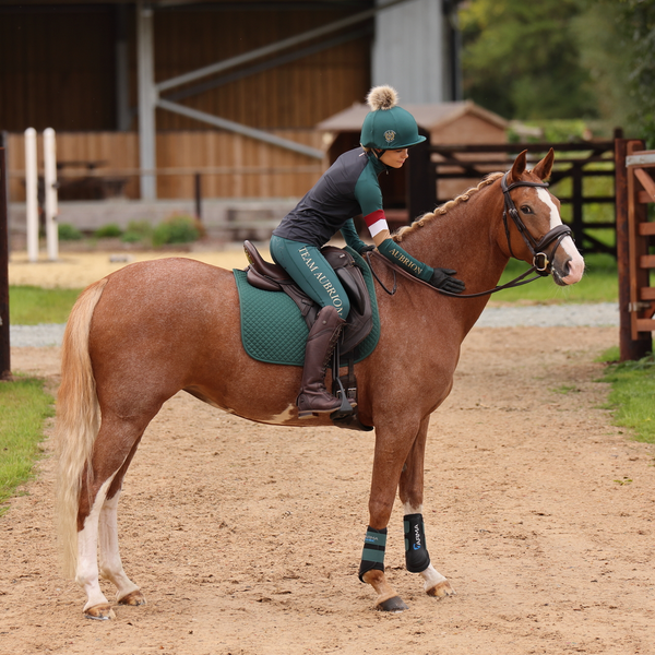 Rider wearing Aubrion Team Long Sleeve Baselayer - Black