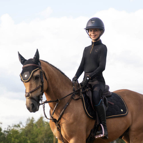Child riding wearing Coldstream Next Generation Ednam Base Layer in black