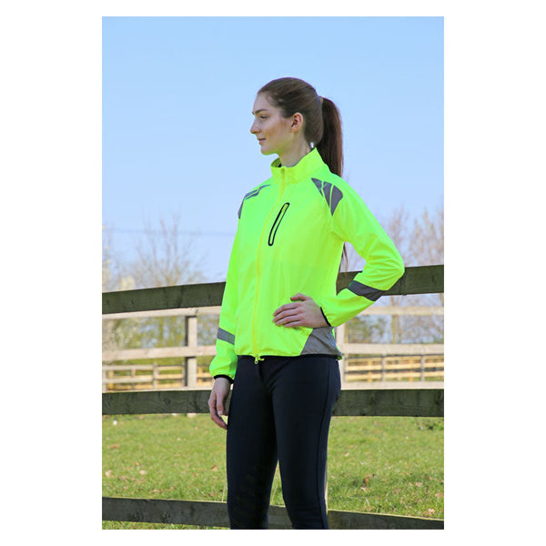 Model wearing Reflector Jacket by Hy Equestrian in Yellow