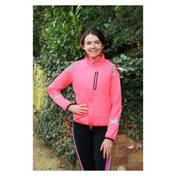 Front view of model wearing Reflector Jacket by Hy Equestrian in Pink