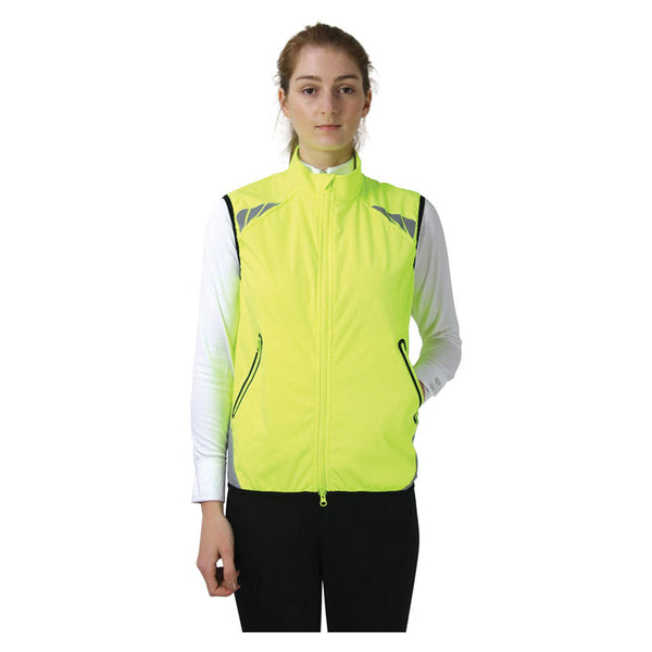 Front view of lady wearing Reflector Gilet by Hy Equestrian in Yellow