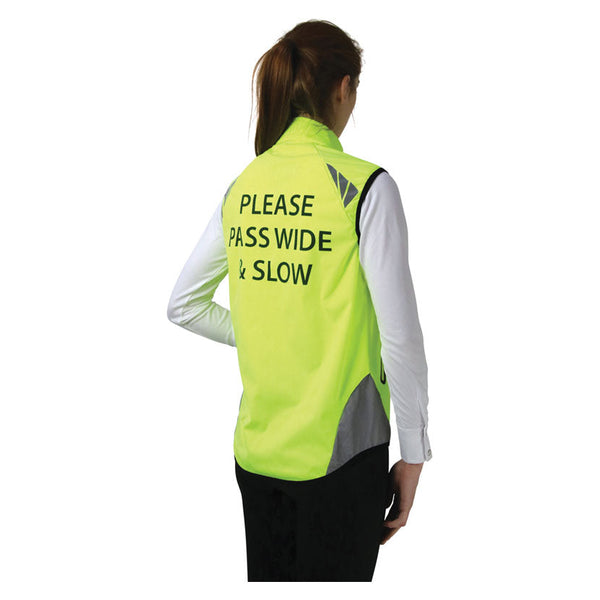 Rear view of lady wearing Reflector Gilet by Hy Equestrian in Yellow