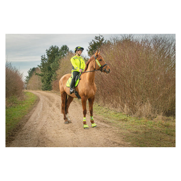 Rider wearing Reflector Gilet by Hy Equestrian in Yellow