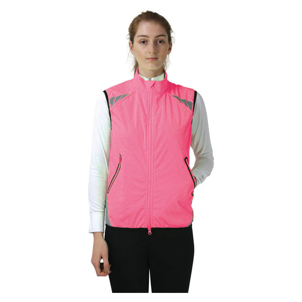 Front view of lady wearing Reflector Gilet by Hy Equestrian in Pink
