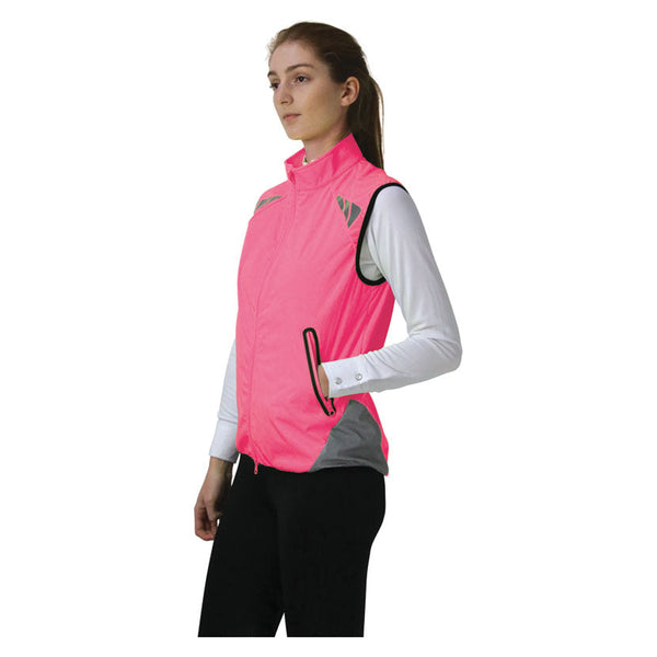 Lady wearing Reflector Gilet by Hy Equestrian in Pink