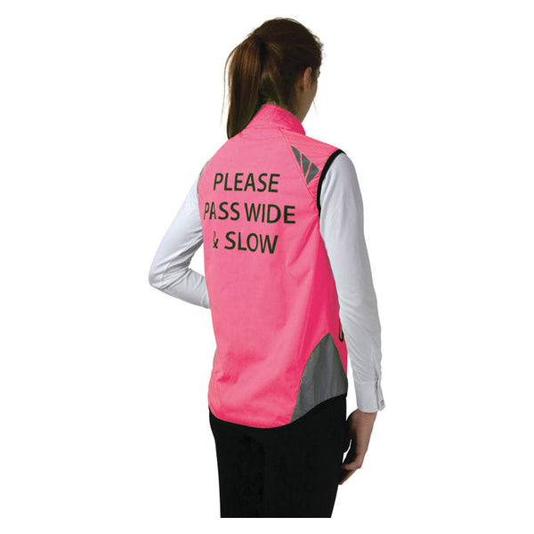 Rear view of lady wearing Reflector Gilet by Hy Equestrian in Pink